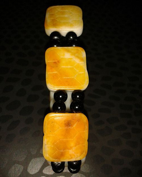 Jade bracelet. Black round jade with golden square jade beads-0