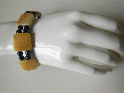 Jade bracelet. Black round jade with golden square jade beads-1